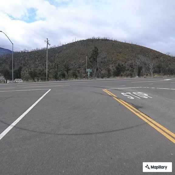 Vehicle with smoking tire on Trinity Mountain Road