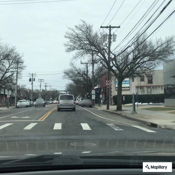 Car crash with smoking vehicle at Merrick Avenue