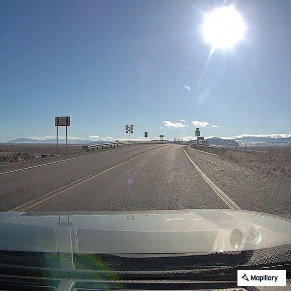 Obstructed license plate on black SUV
