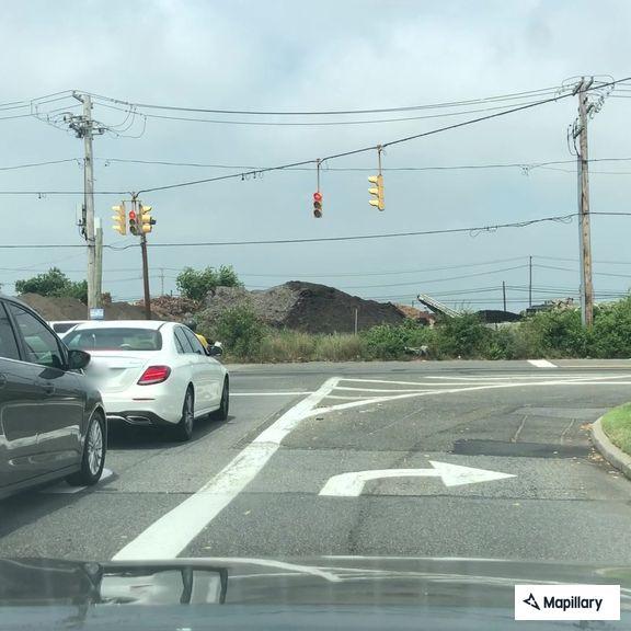 Disabled SUV with broken axle on highway