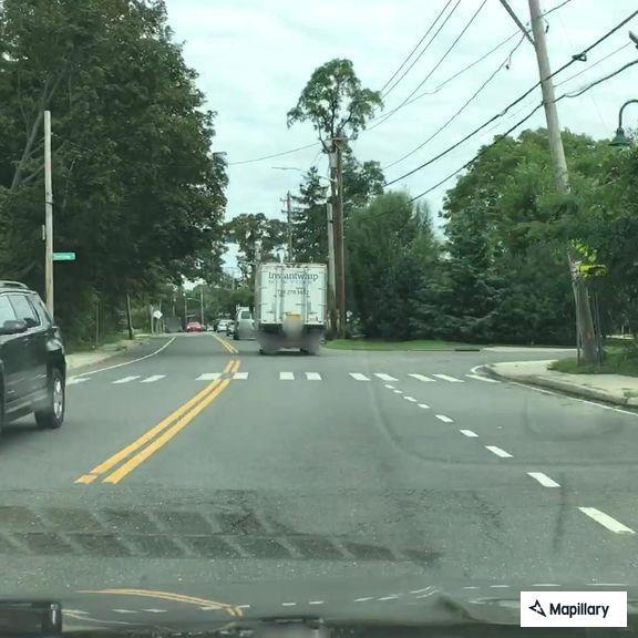 Road hazard from fallen trailer load near restaurant