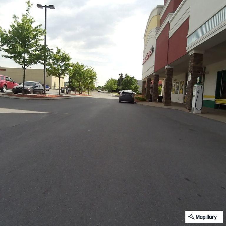 Man reportedly pins woman against store building