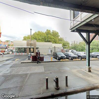 Man holding service gate open and collecting cash