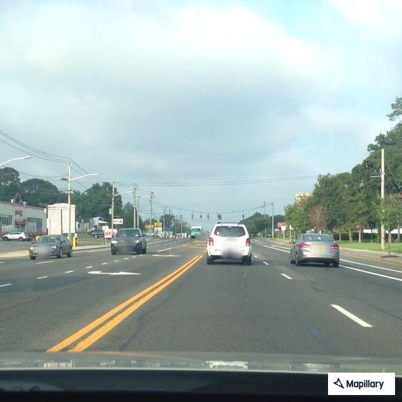 Male yelling to self at intersection in Selden