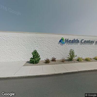 Person with chest pain and difficulty breathing at home