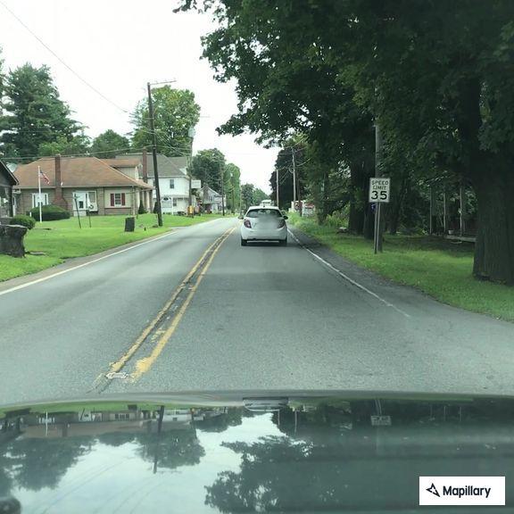 Person experiencing abdominal pain near Route 209
