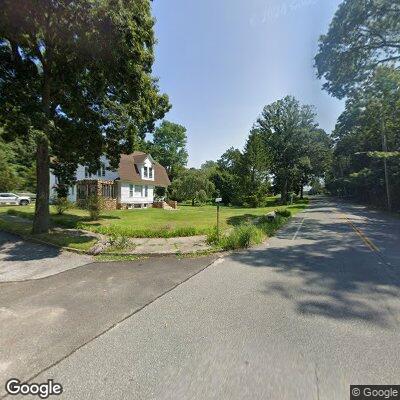 Large tree branches leaning into local roadways