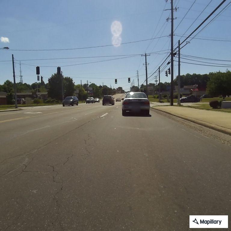 Driver reports unsafe braking by silver vehicle