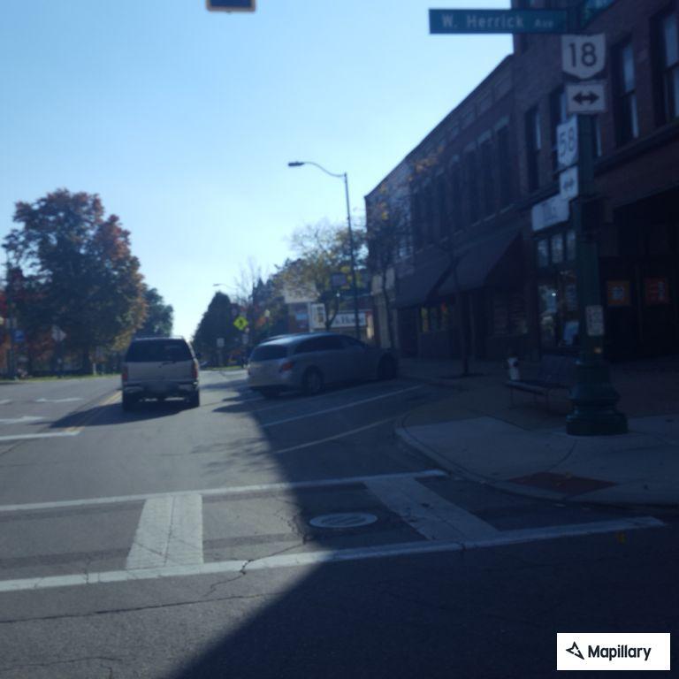 Non-injury crash involving red minivan on Main Street