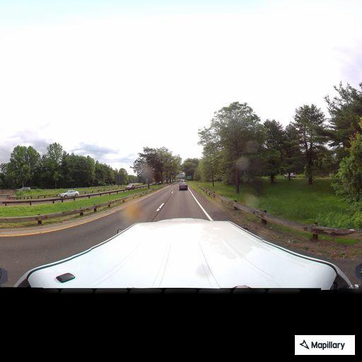 Pedestrian walking along highway shoulder