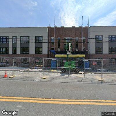 Person experiencing stomach pain at Peekskill apartment