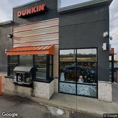 Man in red shorts near Dunkin’ Donuts checked
