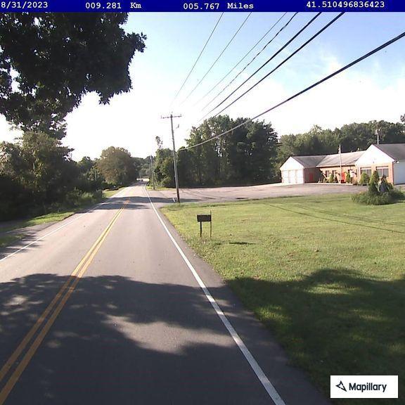 Person hitchhiking near package store in Salem
