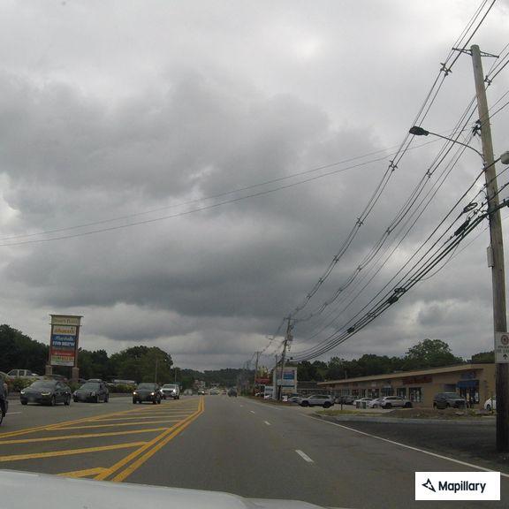 Suspicious man with cart at shopping plaza