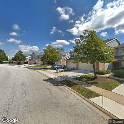 Person experiencing back pain near Club Drive in Glendale Heights