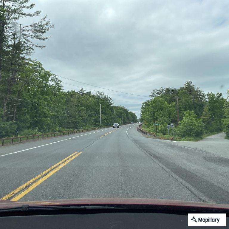 White SUV driving erratically on Route 28 shoulder
