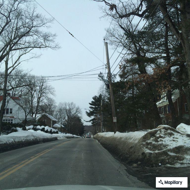 Suspicious person waving at woman on Beacon Street