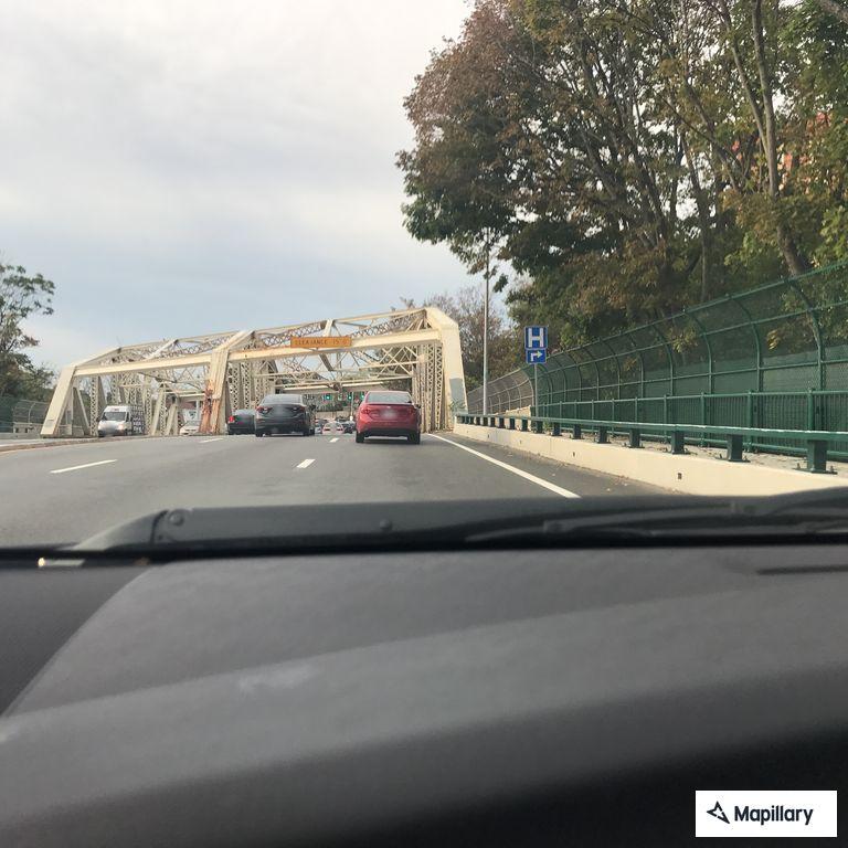 Person walking in and out of roadway on highway