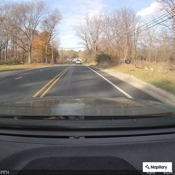 Wrong-way driver in gray vehicle near park toll booth