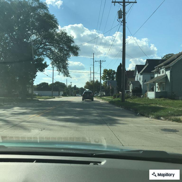 Person experiencing abdominal pain near Liberty Avenue
