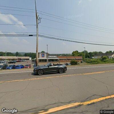 Person waving hammer in Norwich parking lot
