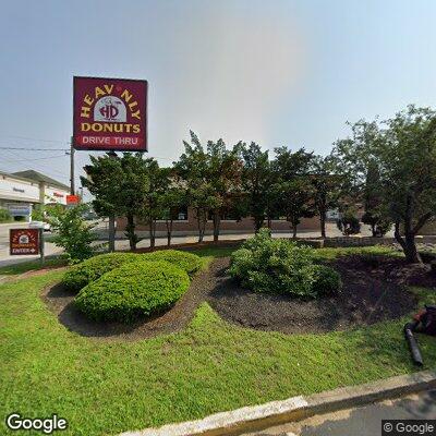 Police stop motorcycle near donut shop