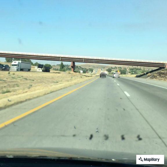 Vehicle off I-84 with smoke near milepost 115