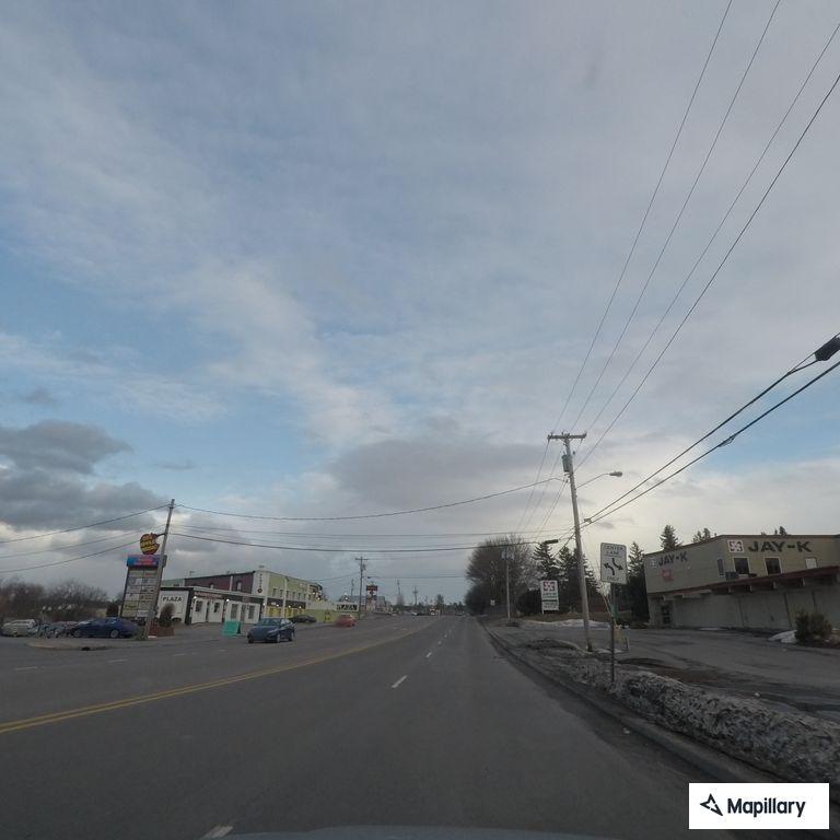 Person slumped over wheel in black SUV, possible overdose