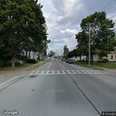 Man stumbling and swinging wrench near intersection