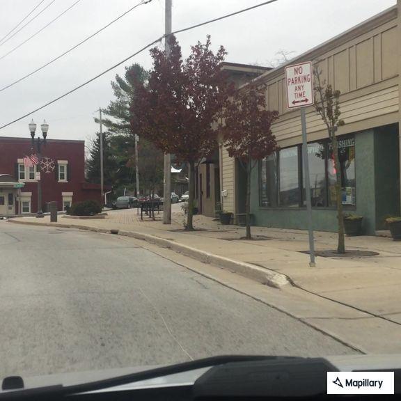 Traffic stop with gray Tesla on North Avenue