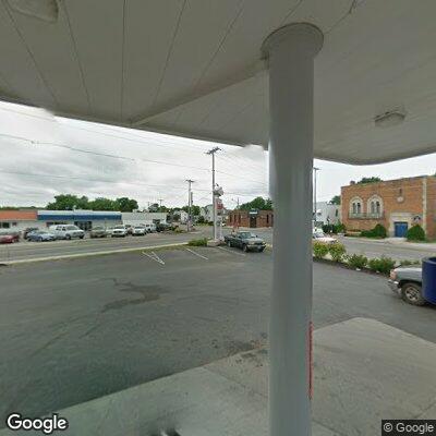 Man in wheelchair on sidewalk outside Ransomville store