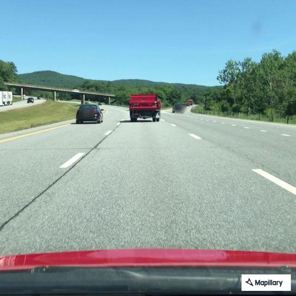 White Jeep parked off side of I-87 on-ramp