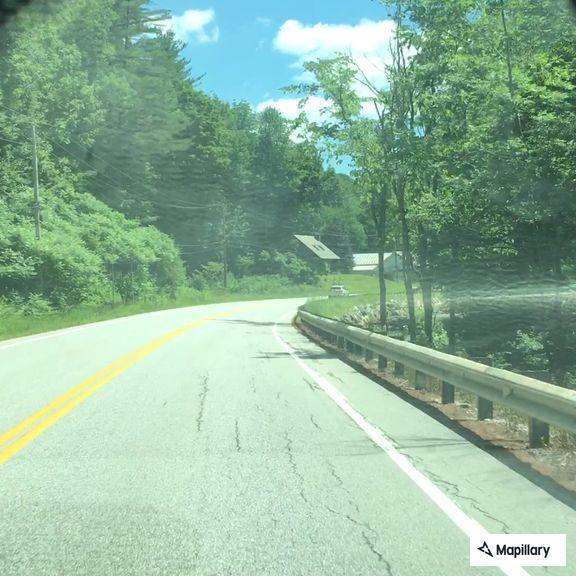 Group of sports cars speeding on Route 100 to Ludlow