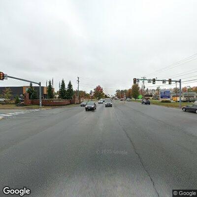 Unresponsive person in wheelchair on median at intersection