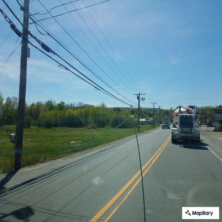 Female sitting in roadway with bicycles at intersection