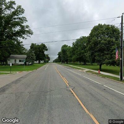 Person unresponsive laying on ground at street corner