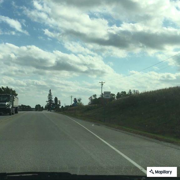 Reckless blue Ford speeding north on Highway 52