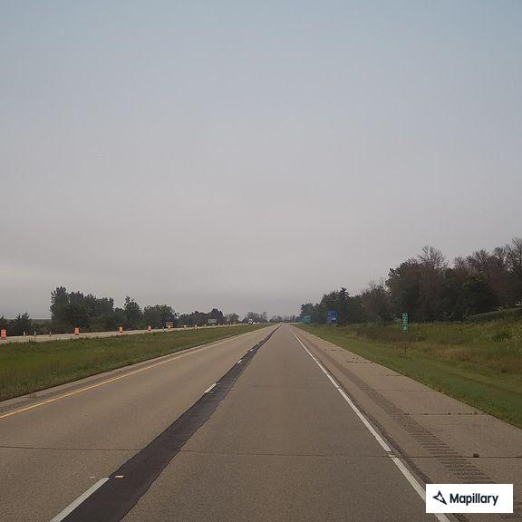 Hay trailer emitting black smoke on I-90