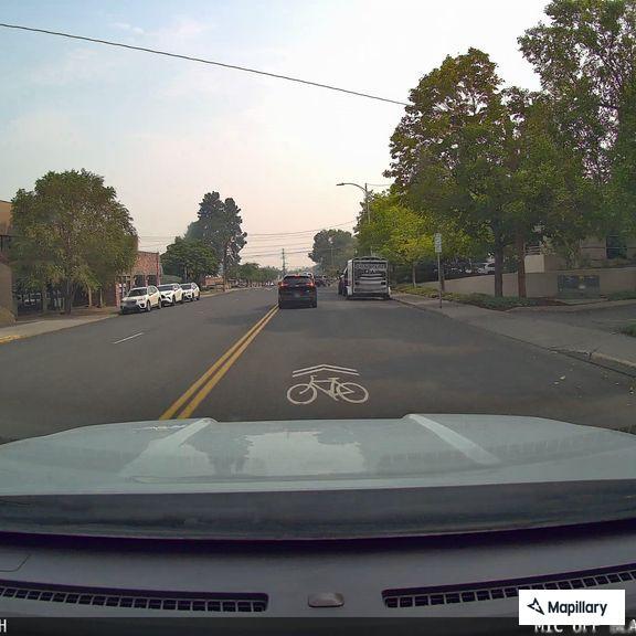 Traffic stop involving gray Subaru at intersection