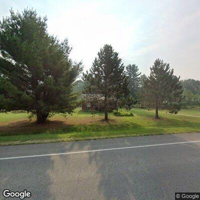 Power line fire spreading into woods near road