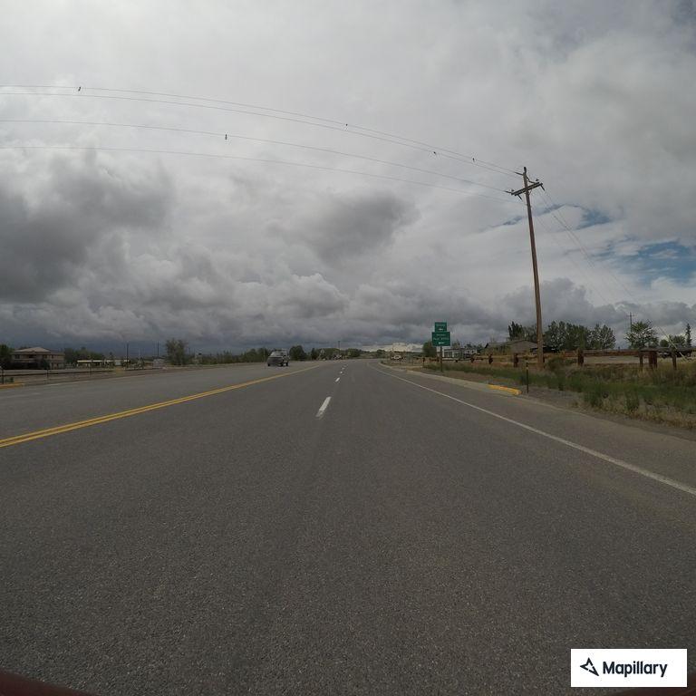 Woman walking in roadway near Deaver