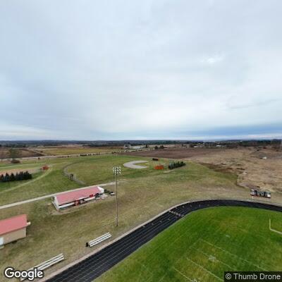 Elderly man possibly having stroke at high school field