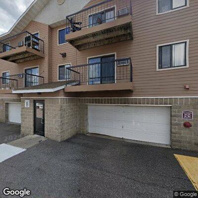 Person having headache at Champlin Drive apartment