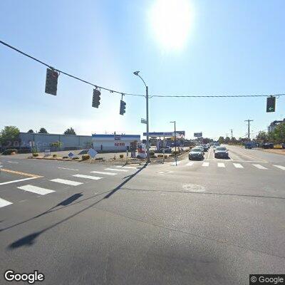 Man walking in and out of traffic at street intersection