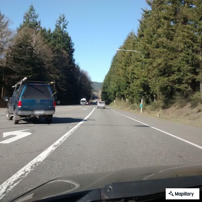 Erratic white work van on Highway 104 eastbound
