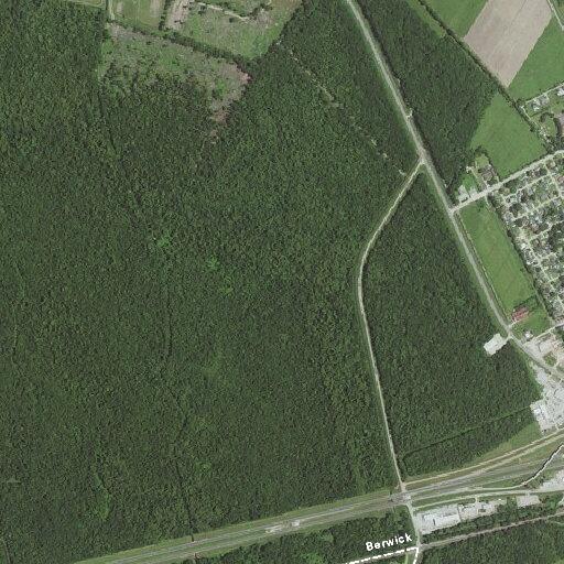 Man with pipe walking near highway traffic line