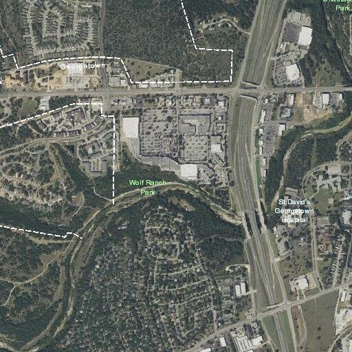 Search for wanted assault suspect near motel