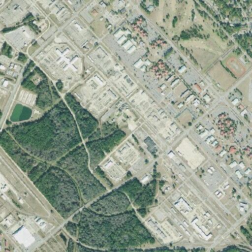 Suspicious black sedan reported near Main Road