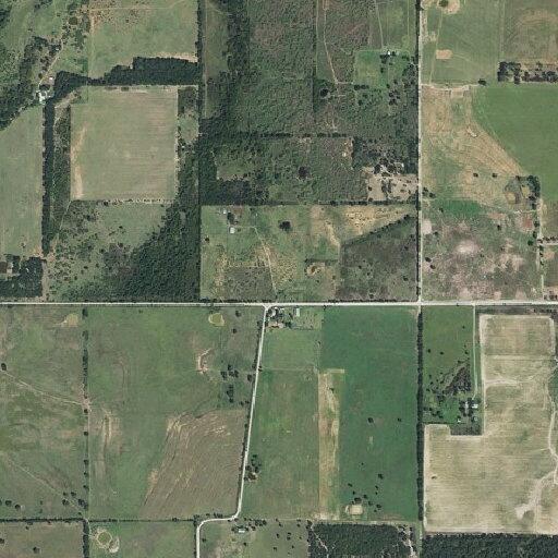 Grass fire threatens structure near (person_name withheld) Place in Eastland