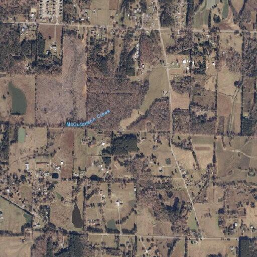 Suspicious sedan parked in vacant field